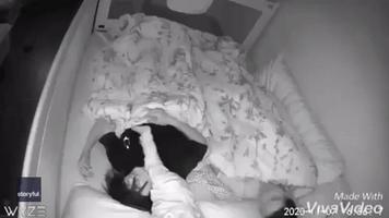 Baby Monitor Captures Infant Refusing to Sleep and Climbing All Over His Mom