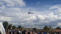 Kenyan Man Takes Hold of Helicopter and Doesn't Let Go