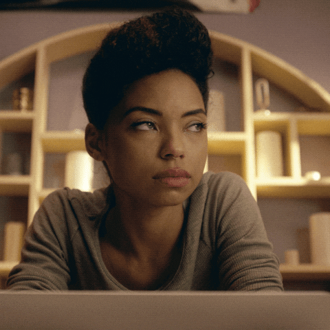 TV gif. Logan Browning as Samantha in Dear White People. She's reading something on her laptop and she takes a deep breath while performing a huge eye roll, throwing shade at what she's reading.