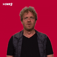 Video gif. Man looks exasperated as he turns his head up to the ceiling and splutters out of his mouth.