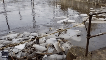 Chunks and Sheets of Ice Crash Down Iowa Dam
