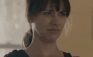TV gif. Rashida Jones reacts with disgust as if she's saying "blah."