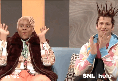 SNL gif. Kenan Thompson as DJ Dynasty Handbag raises the roof while Andy Samberg as T'Shane claps with his nostrils flared in amazement.