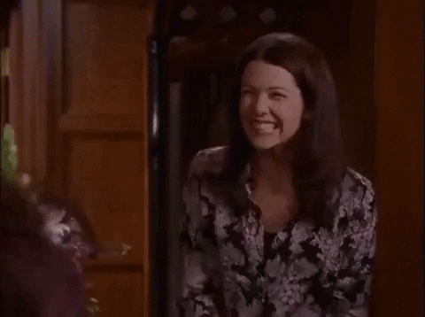 TV gif. From Gilmore Girls, Alexis Bledel as Rory runs up to hug her mom Lorelai, played by Lauren Graham, who receives her with a big grin.