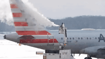 Rochester Airport Crews De-Ice Planes During East Coast Winter Storm