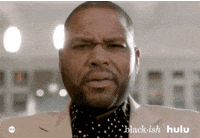 TV gif. Anthony Anderson as Andre in Blackish stares down at us, eyebrows furrowed as he slowly mouths the word, "Damn."