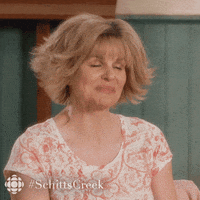 Schitts Creek Shrug GIF by CBC