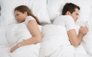 couple in bed relationship problems GIF
