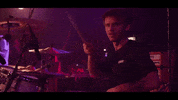 Mindblind grin leon drumming mindblind GIF