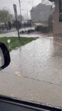 Hail Bounces Off Car as Thunderstorm Sweeps Through Macomb