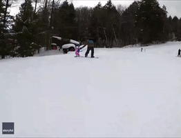 Tethered Toddler Hitches a Ride While Learning to Snowboard
