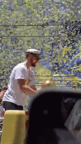 Klay Thompson Holds NBA Championship Trophy During Parade