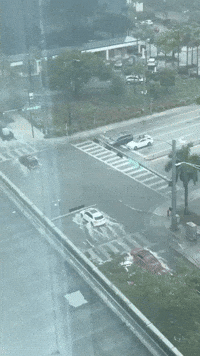 Motorists Traverse Flooded Streets During 'Life-Threatening Flash Flooding' in South Florida