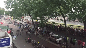 Man Hits the Ground Hard While Scrambling for a Waterbottle at the Tour De France