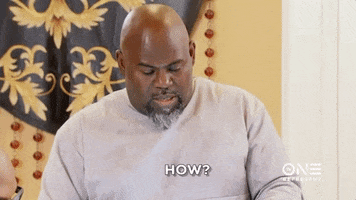 TV gif. The camera zooms in on Actor David Mann on the Manns as he looks down to read something. His head pops up with surprise and a little bit of concern, and he says, “How?” 