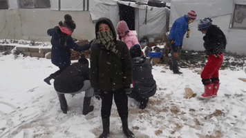 Syrian Refugee Children Build Snowman as Cold Weather Hits East Lebanon