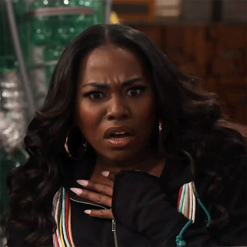 TV gif. Laci Mosley as Harper on iCarly has her hand on her chest and looks at us in shock.