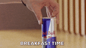 Ad gif. A man pops open a can of Red Bull and chugs it. Text, “Breakfast Time.”