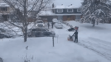 Snowmobile Races Through Snowbound Ottawa Neighborhood