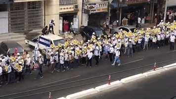 Marchers Stream Down Yangon Street as Anti-Military Protests Continue