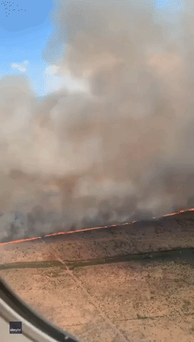 Huge Brush Fire Seen From Plane Flying Over Maui