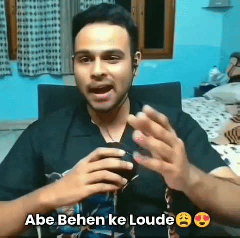 Video gif. A man with wired earphones sits in a chair and gestures towards us with a serious expression as he talks into a microphone. Text reads, "Abe behen ke loude. Pagal hai kya. Yehi maar dunga. Khatam kar dunga tujhe."