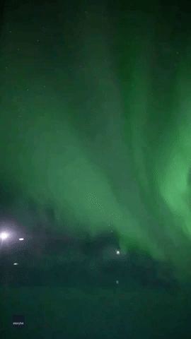 Plane Passenger Captures Stunning Green Aurora Over Antarctica