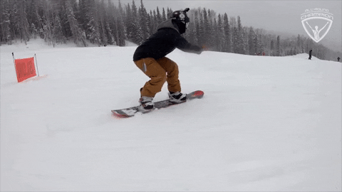 Sports gif. Snowboarder shreds wildly through the snow down a mountain.