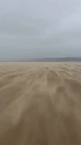 Storm Bella Whips Up Sand on Welsh Beach