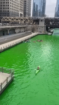 Kayakers Paddle on Green Chicago River as City Celebrates St Patrick's Day