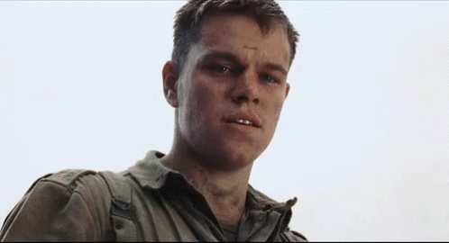 Movie gif. We look up at a young, disheveled Matt Damon in Saving Private Ryan as he gradually morphs into a senior man.