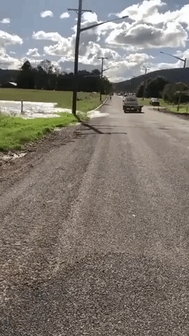Footage Shows River Overflowing, Inundating Road in New South Wales