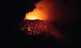 Lava Shooting From Spain's Cumbre Vieja Volcano Glows Against Night Sky