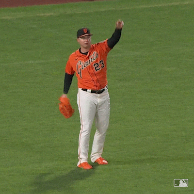 Sports gif. Brandon Crawford of the San Francisco Giants raises his hands over his head then falls in on himself, holding his stomach like he can't believe what just happened. 