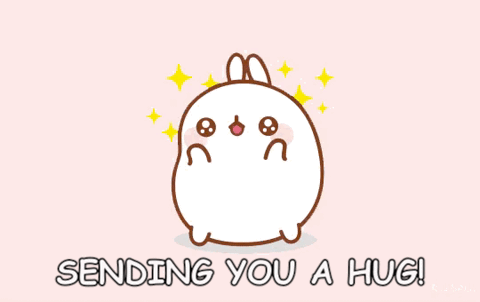 Kawaii gif. A round, white, bunny-like creature opens its arms, ready for a hug, with shining eyes and stars in the background. Text, "Sending you a hug!"
