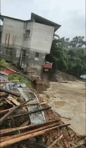 House Collapses Into River Amid Deadly Flooding in China