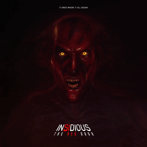 Animated graphic gif. From the movie poster for Insidious: The Red Door, we see a close-up of the face of the demon character with glowing red eyes as its jaw drops open, exposing the creepy silhouette of a man in the red light of an open door.