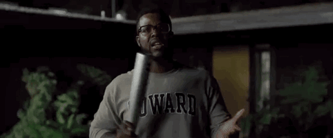 Movie gif. Winston Duke as Gabe from the movie, Us, smacking his hand with a metal baseball bat while exclaiming, "we can get crazy."