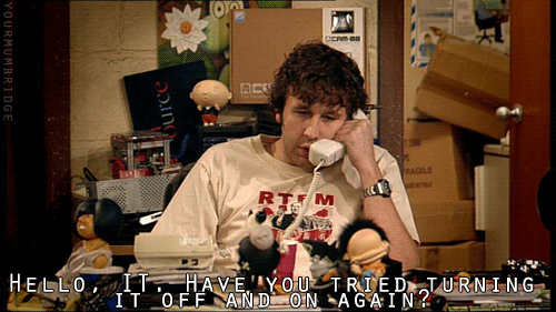 Meme from The IT Crowd with the quote “Hello IT, have you tried turning it off and on again?”, used to humorously highlight the contrast with Testing Salesforce Agentforce IT Service.