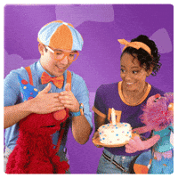 Sesame Street gif. Elmo and Abby with Blippi and Meekah of Blippi, Blippi covering Elmo's eyes then revealing Meekah and Abby holding a birthday cake, as everyone gets excited and dances.
