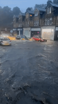 Cars Drive Through Floodwaters Amid Heavy Rain in Sheffield