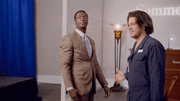 TV gif. Aldis Hodge as Alec and Christian Kane as Eliot on Leverage high five twice and then fist bump in cool celebration, while not even looking at each other to signify how cool they are. 