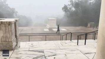 Sentinel Stands Watch at The Tomb of The Unknown Soldier Amid Wild Storm