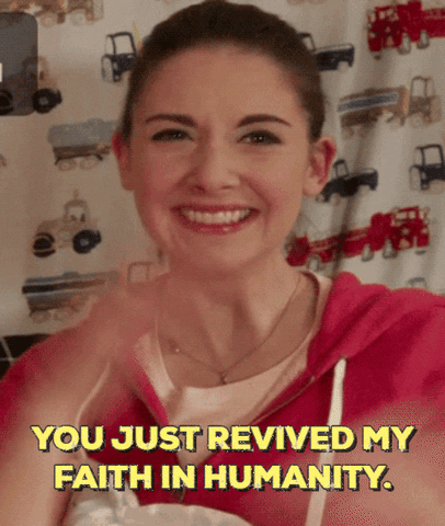 Celebrity gif. Alison Brie smiles proudly and admiringly while clapping. Text, "You just revived my faith in humanity."