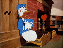 Cartoon gif. Donald Duck is leaning against a wall and he's giving himself resuscitation as hearts flood out from his chest and eyes.