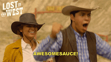 TV gif. Niko Guardado as Dave Flowers and Fallon Smythe as Lisa on Lost in the West wear cowboy hats. Lisa smiles as Dave jumps up and fists in the air. He excitedly says, “Awesomesauce!”