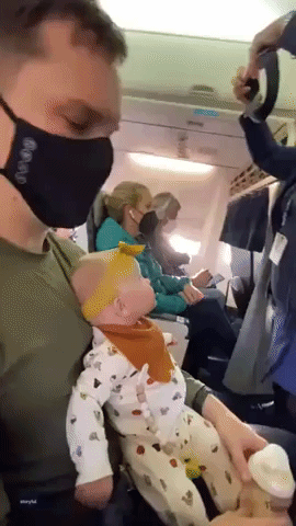 Adorable Baby Enthralled by Alaska Airlines Safety Demonstration on Her First Flight