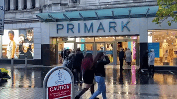 Shoppers Wait in Line in Liverpool as Coronavirus Lockdown Eases Across England