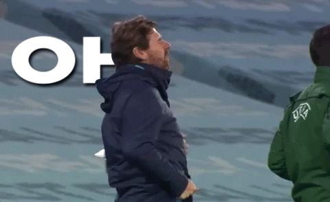 Sports gif. André Villas-Boas turns and tosses his head back as he thrusts his fists down in frustration and says, "Oh, come on."