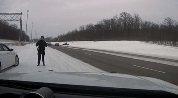 Quick-Thinking Ohio Police Officer Dodges Vehicle Sliding on Icy Highway